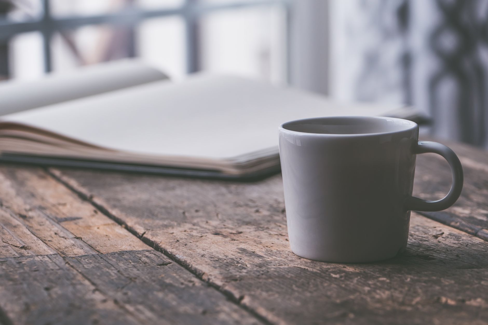 A mug of coffee on a rustic wooden table, perfect for a cozy moment or reading session. — Jet234’s Gacor Slot Creates Nonstop