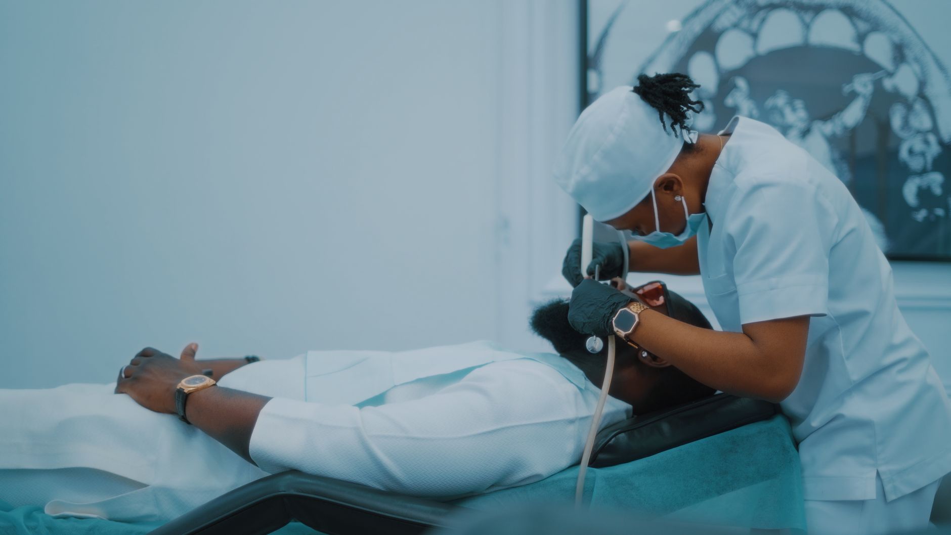 A dental professional performs a procedure on a patient in a Lagos clinic. — Unveiling the Secrets of Evening Primrose Oil an