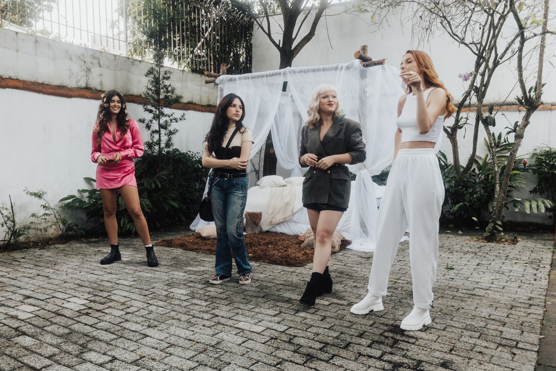 A diverse group of women models posing outdoors in stylish outfits, showcasing fashion trends. — Wireless Bra: Soft and Flexi