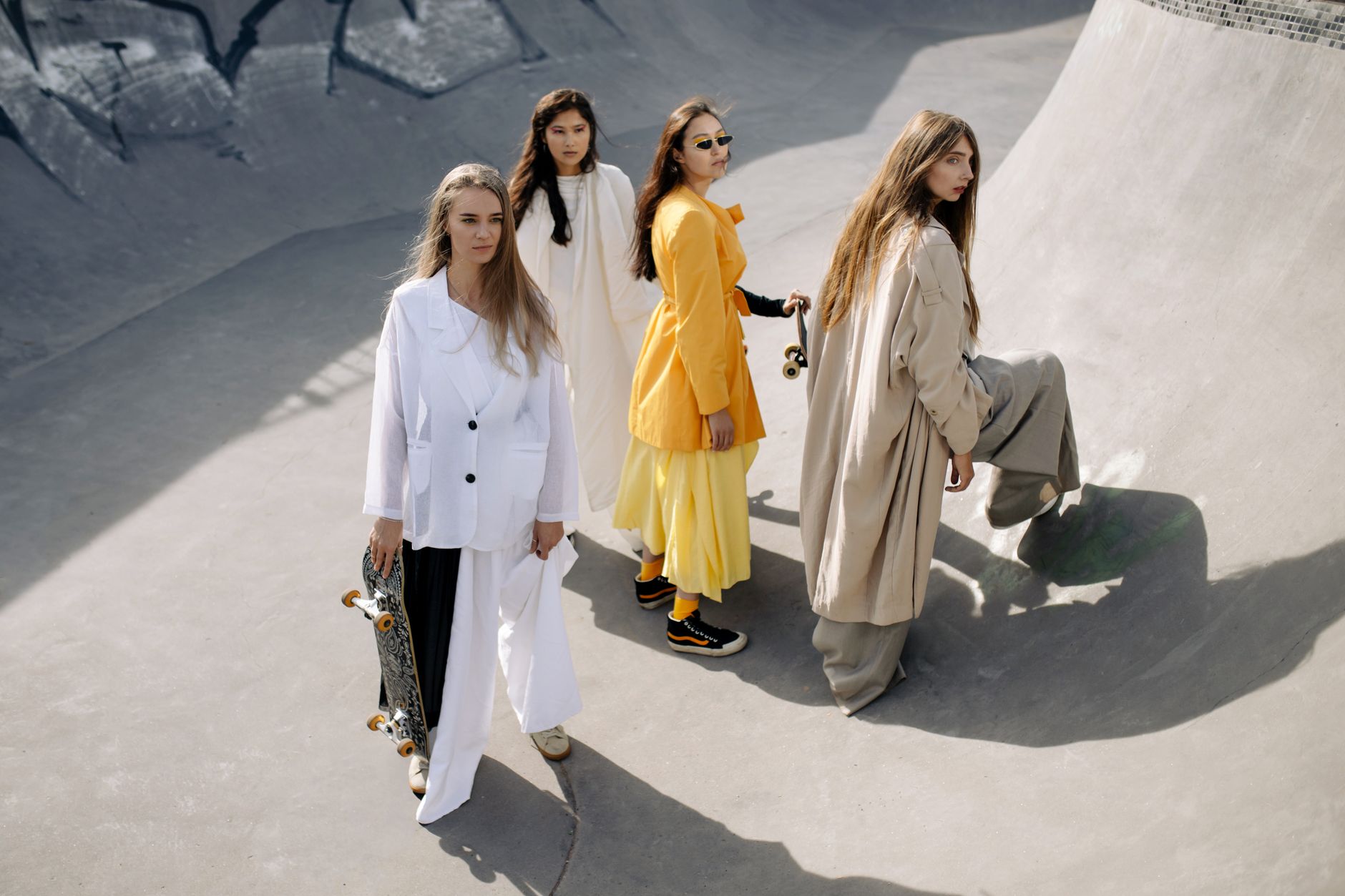 Stylish women posing creatively at a skate park in modern outfits. — Yupoo Gallery Solution for Organized Visual Content